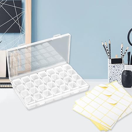 Clear plastic storage box with 28 adjustable compartments and label for organizing jewelry.