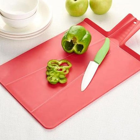 Zambeel folding chopping board resting on a kitchen counter ready for vegetable preparation.