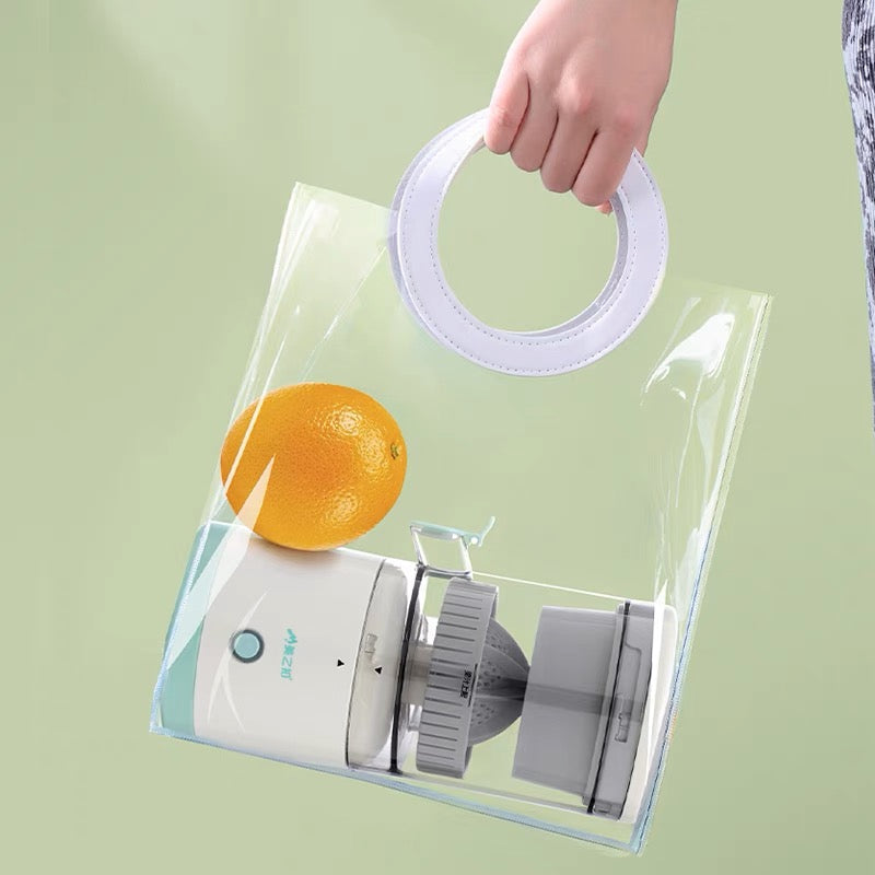 Automatic fruit juicer extracting fresh citrus juice into a stainless steel collection cup