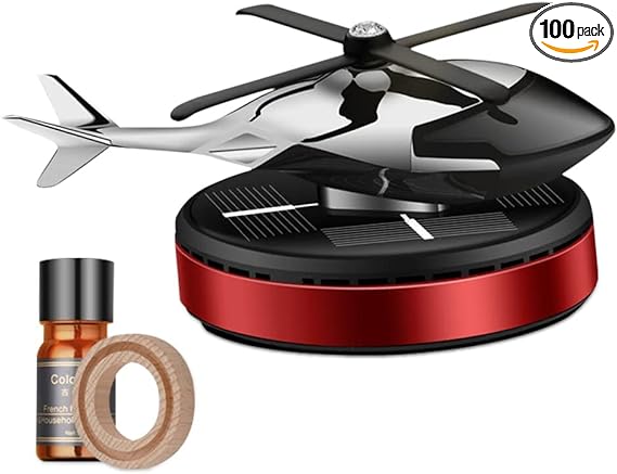 Helicopter-shaped car air freshener clipped to vehicle dashboard vent for interior scent diffusion