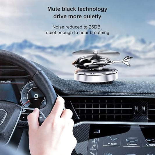 Helicopter-shaped car air freshener mounted on a vehicle air vent to diffuse cabin fragrance.