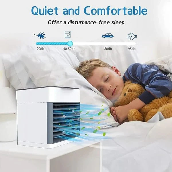 Portable air conditioner fan with LED lamp, humidifier, and purifier resting on a wooden desk.
