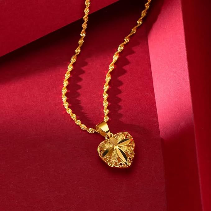 Gold heart pendant necklace for women displayed on a neutral background with a fine chain.