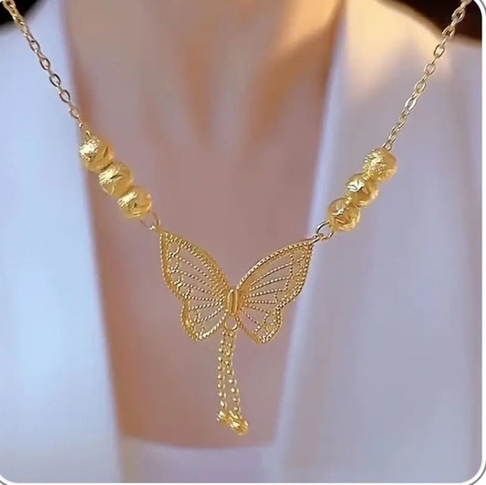 Gold plated butterfly necklace for women displayed on a clean white background