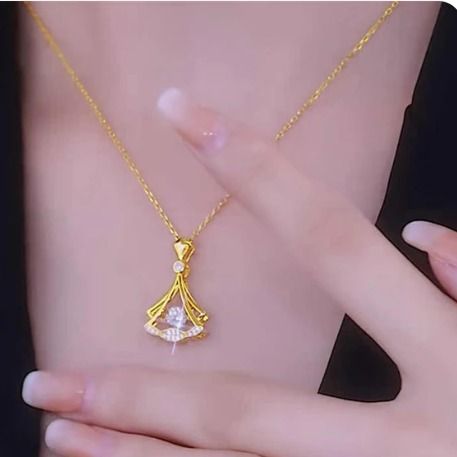 Gold plated fan necklace pendant displayed on a fine chain for everyday wear