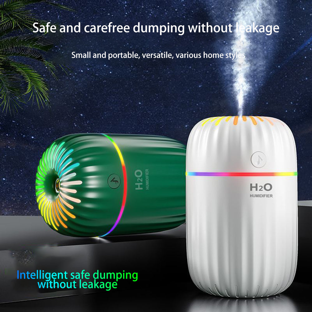 KSA DROP 3 in 1 air humidifier emitting fine mist on a bedroom nightstand.