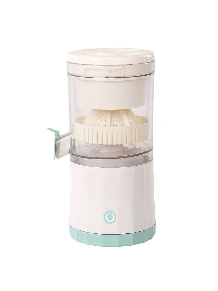 Electric automatic fruit juicer pressing oranges into a stainless steel cup on a kitchen counter.