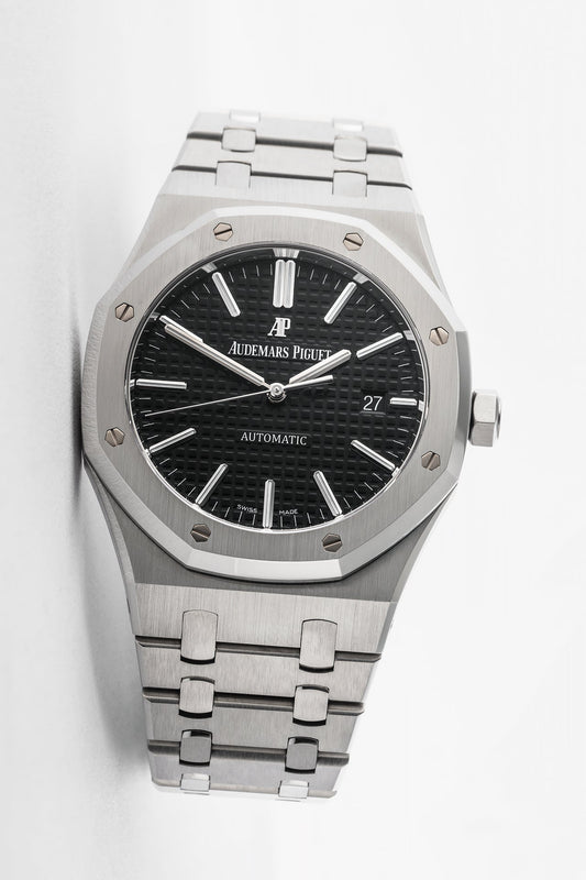 Stainless steel Audemars Piguet Royal Oak selfwinding watch with octagonal bezel and integrated bracelet.