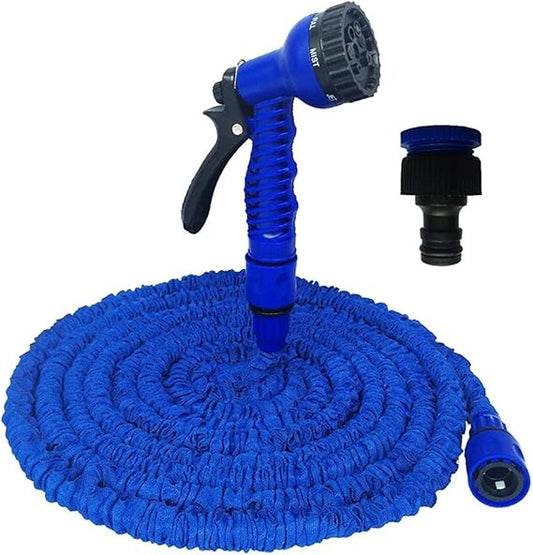 Water spray nozzle attached to an expandable garden hose pipe for outdoor lawn and plant watering.