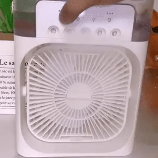 Portable mini USB fan emitting cooling water mist spray for desktop personal use